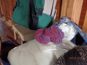 This hot mess of overspun Merino that looks like a 106 yard long hair scrunchy.